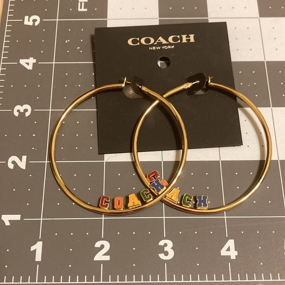 NWT Gold tone large hoop lever back earrings w/multicolored block letter  logo - Picture 6 of 6